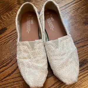 TOMS metallic daisy slip ons